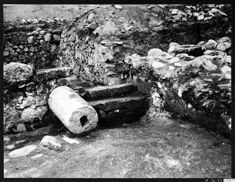 Excavation at Cholades, Soli, with stone steps, a fallen column drum and rubble walls