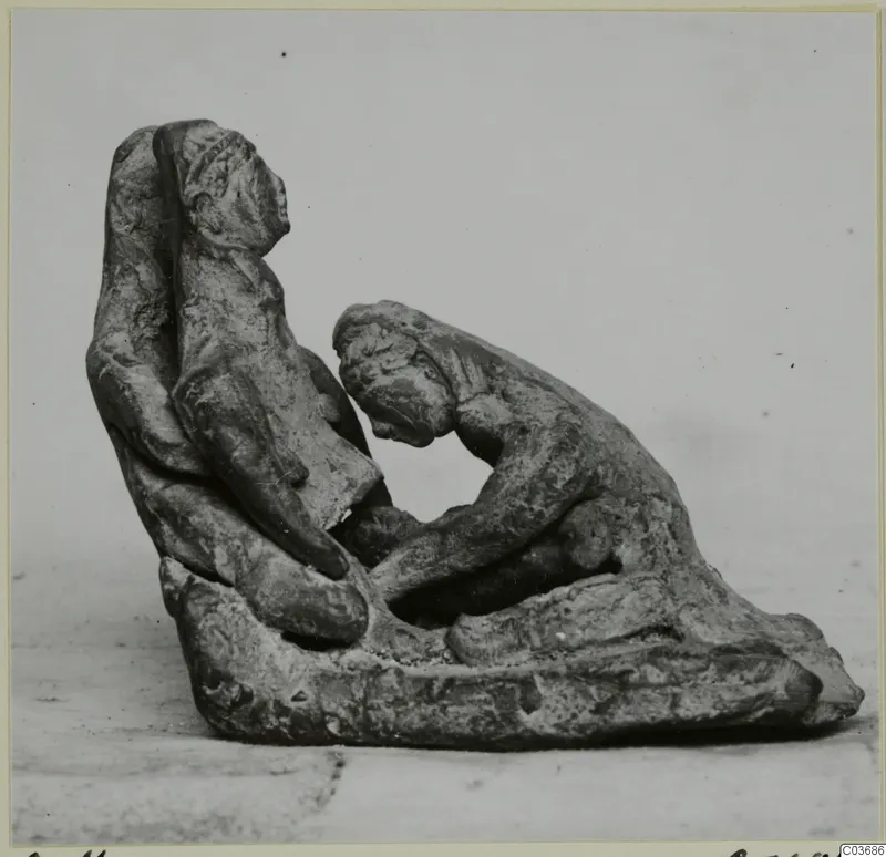 Terracotta group of two human figures on a shared base, one upright and one bent forward toward it