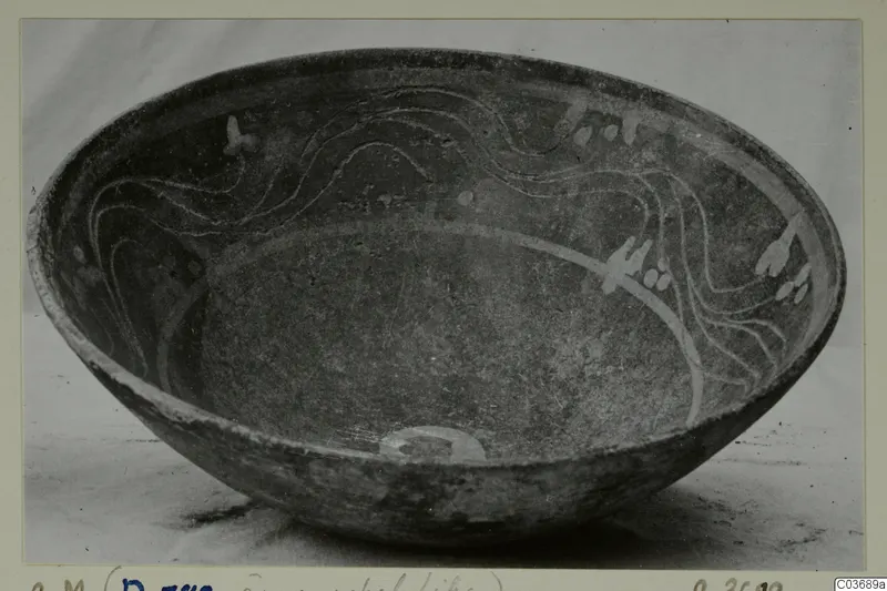 Bowl with light painted wavy lines and blob motifs on its inner wall, catalogued as a Cypro-Hell. II bowl