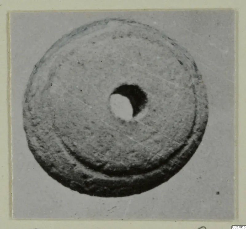 Disc-shaped object with a central hole, from Vouni, shown from above.