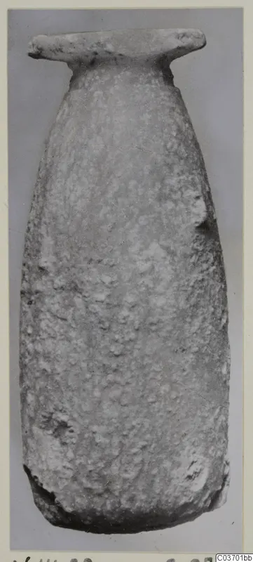 Tall alabaster vase with a flat, wide rim and tapering body, from Vouni