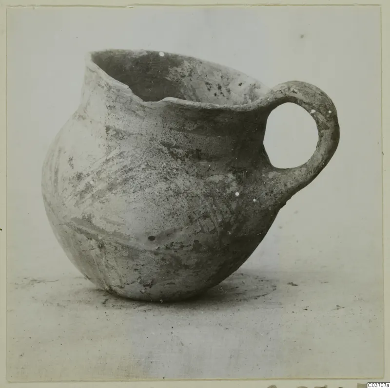 Pottery jug with a single loop handle and wide, slightly uneven mouth, a find from Enkomi