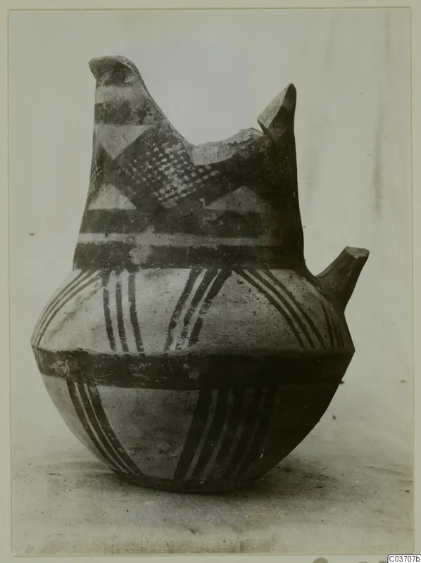 White Painted IV-V pottery vessel from Enkomi with dark painted bands, hatched triangles and a broken neck