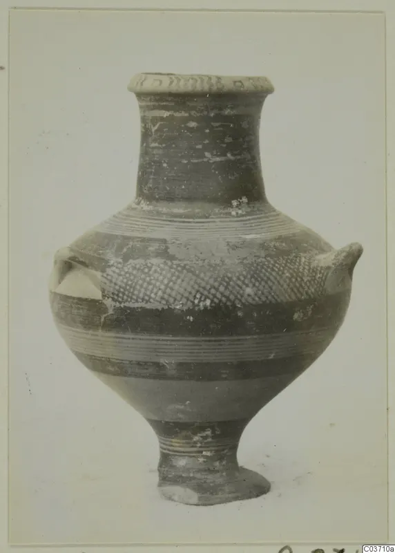 Pottery bowl-jar with two small lugs on the shoulder, a tall neck, and dark banded and hatched painted decoration.