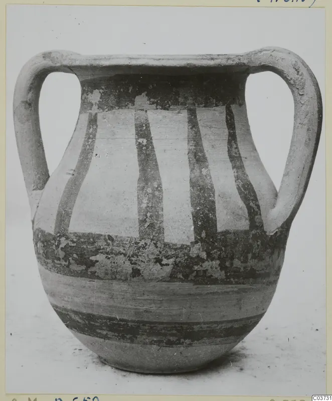 Two-handled painted pottery vessel with dark vertical and horizontal bands on a pale surface