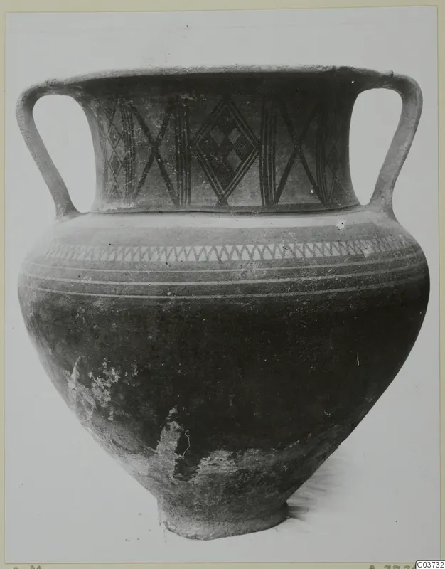 Two-handled pottery jar with black painted lattice and zigzag decoration
