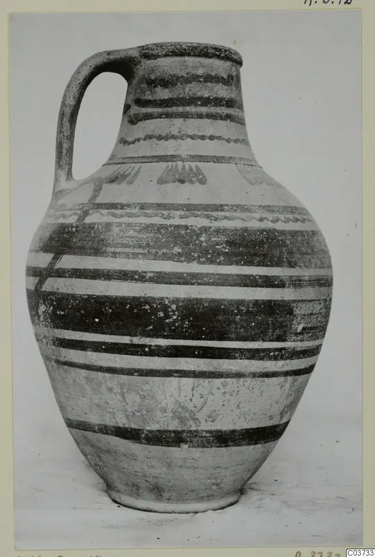 Pottery Bichrome VI-VII jug with a strap handle and dark painted bands on a pale surface