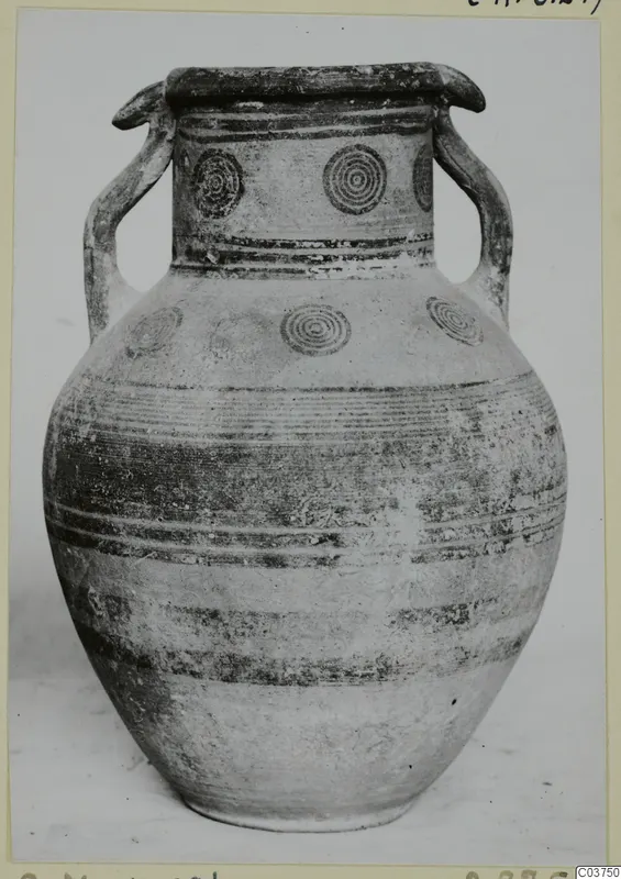 Two-handled pottery jar, White Painted IV, with concentric circle motifs on the neck and shoulder and painted bands on the body