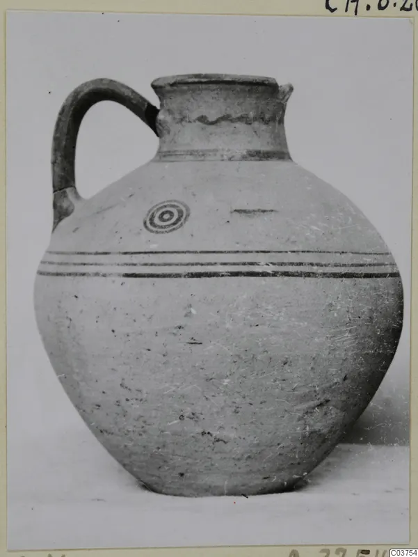 Pottery jug with a single handle, dark banded decoration and a concentric circle motif on the shoulder (White Painted III-1)
