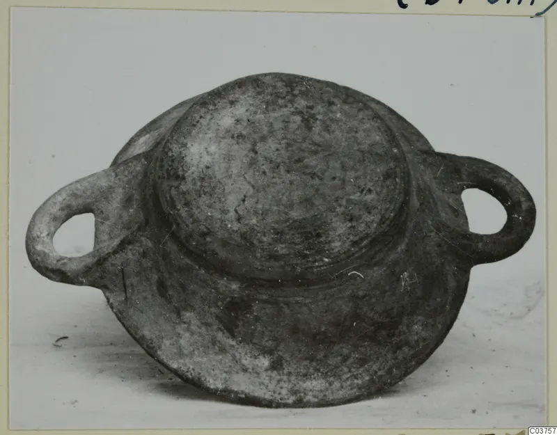Two-handled vessel with a domed centre and broad base, grey-brown surface