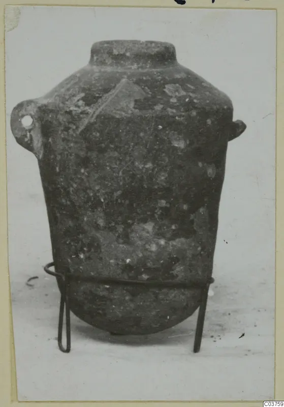 Pottery White Painted I amphora with two small handles, standing on a thin wire stand