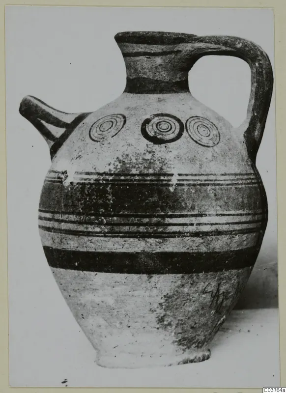 Painted pottery jug with a spout, strap handle and concentric circles on the shoulder, Pottery Bichrome III