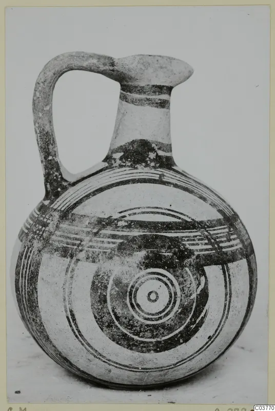 Pottery White Painted IV: jug with a single loop handle, painted bands and concentric circles on the body