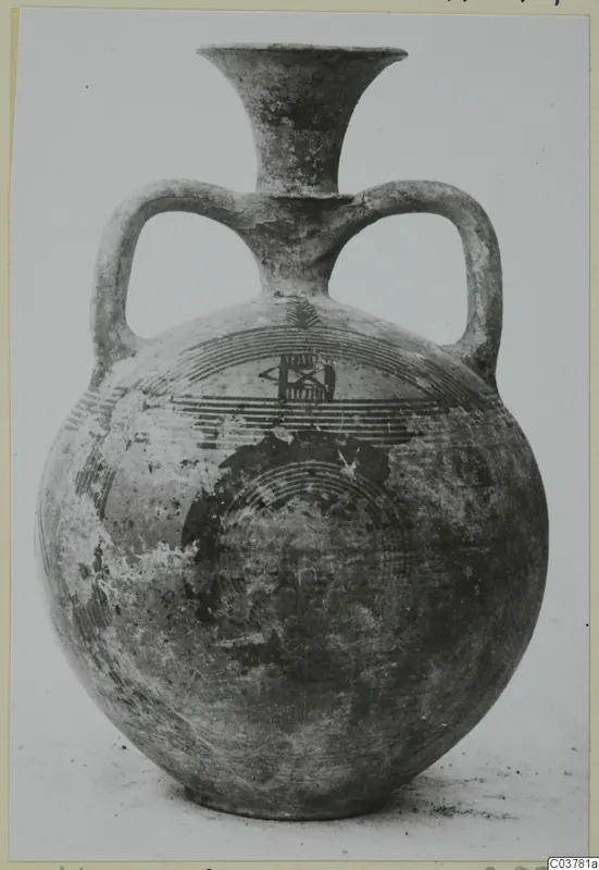 Black-on-Red I-III pottery: two-handled globular jug with a flaring neck and painted concentric bands