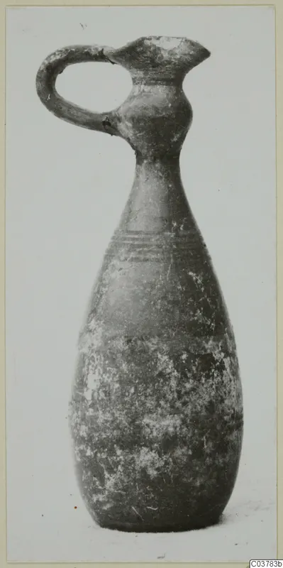 Pottery jug with a loop handle, long neck and pear-shaped body