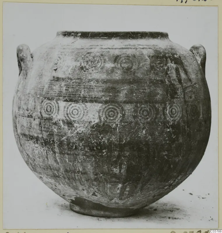 Round-bodied painted pot with two handles and rows of concentric circle motifs