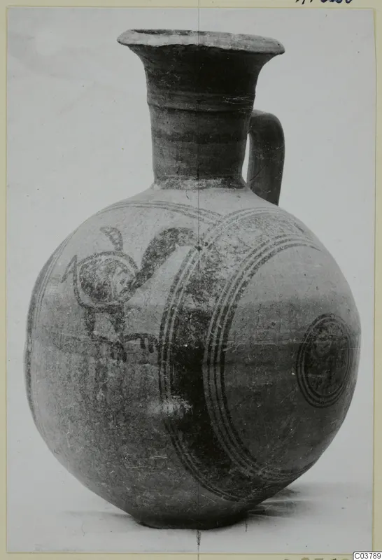 Bichrome IV jug with a globular body, tall flaring neck and loop handle, painted with concentric circles and a bird-like motif.