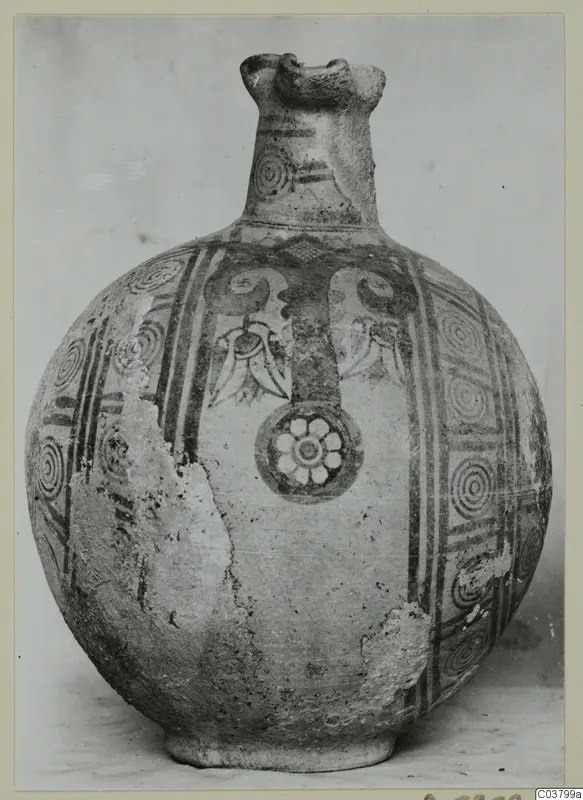 Round-bodied painted jug with a trefoil mouth, its body decorated with concentric circles, bands and a flower roundel.