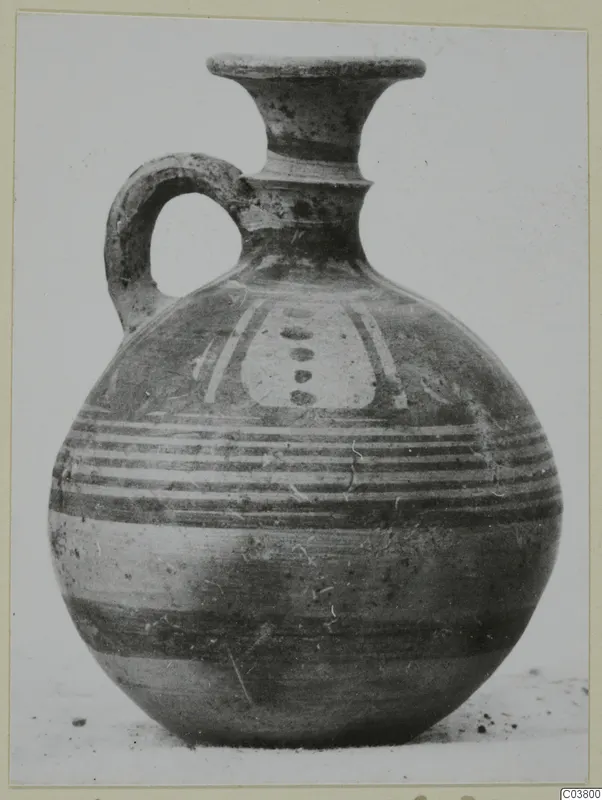 Painted jug with a flaring neck, strap handle and horizontal bands, Pottery Bichrome IV