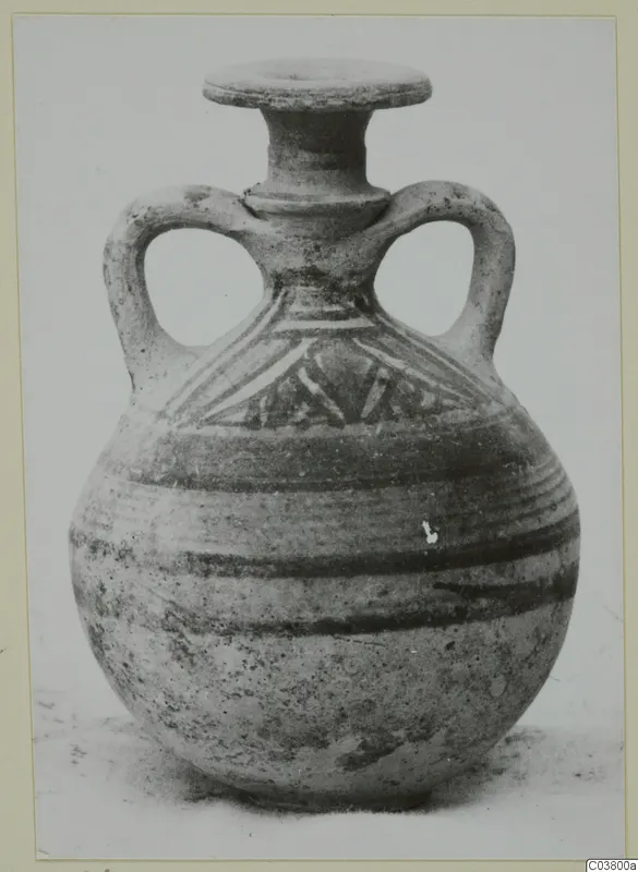 Round-bodied jug with two loop handles, a flat-rimmed neck and painted bands and triangles on the shoulder.