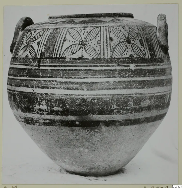 Globular jar with two handles, painted with a band of circle patterns and horizontal stripes; Bichrome pottery in the Cyprus Museum