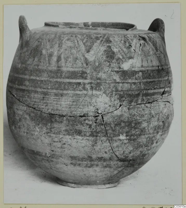 Pottery Bichrome IV jug from the Cyprus Museum, round-bodied with two handles and painted bands