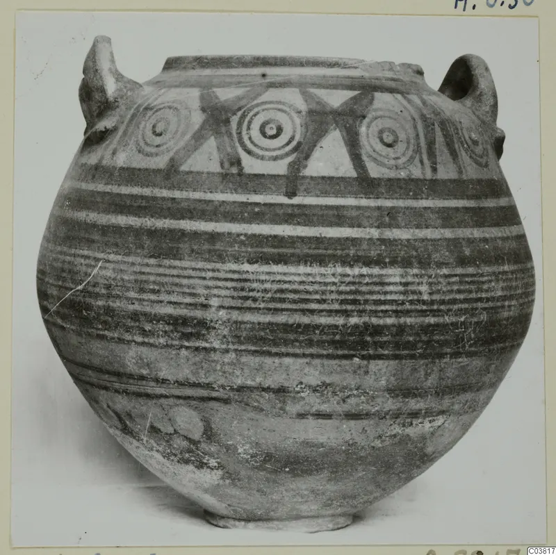 Globular pot with two handles and a painted band of concentric circles and horizontal bands, photographed on a card mount
