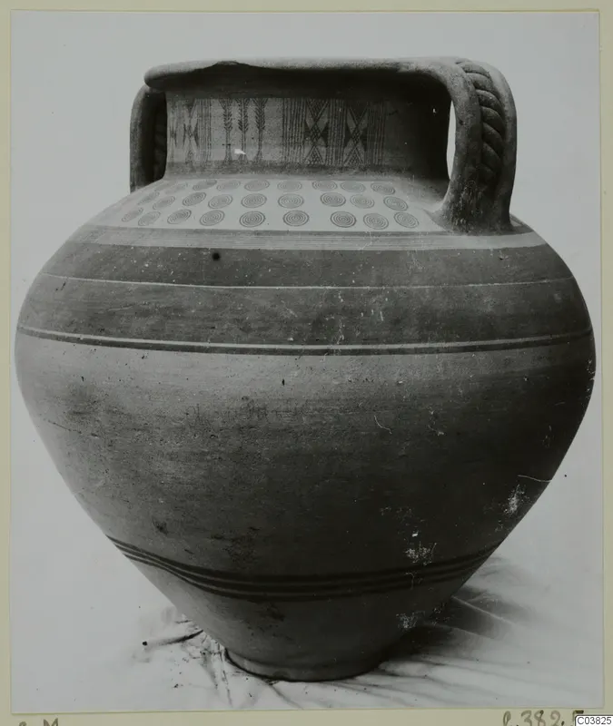 Amphora-crater with painted concentric circles on the shoulder and zigzag bands on the neck, photographed against a plain background