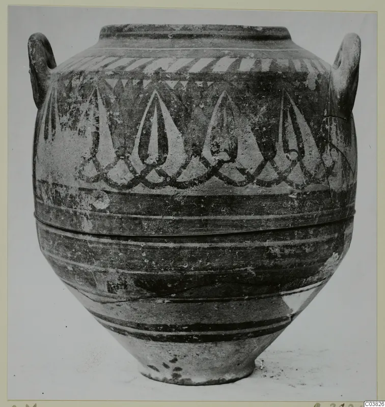 Two-handled painted pottery jar with pointed drop-shaped motifs and painted bands around the body