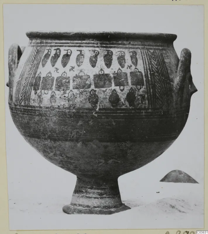 Large footed vessel with two handles, painted with rows of bird-like motifs and panels, photographed on a pale background
