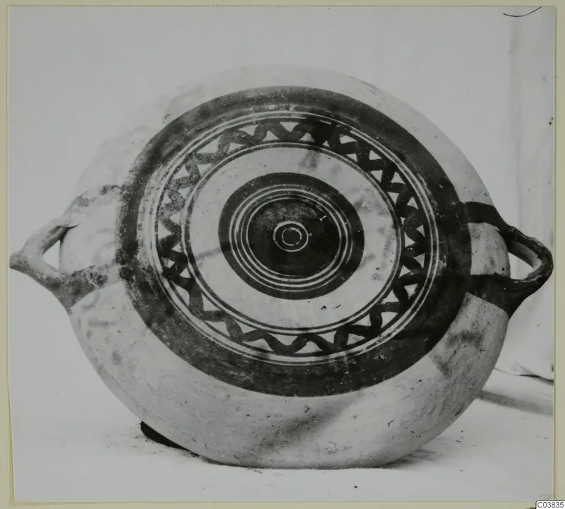 Pottery Bichrome III: round painted vessel with two handles and a pattern of concentric rings and a wavy band