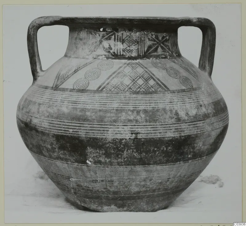 Two-handled painted jar with concentric circles and cross-hatched panels on the shoulder and neck