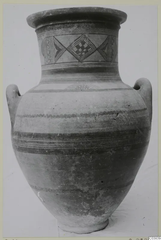 Painted two-handled jar with diamond motifs on the neck and banded decoration on the body, shown against a plain background.