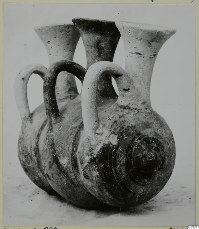 Pottery vessel with three flaring necks and loop handles, titled Pottery Bichrome III