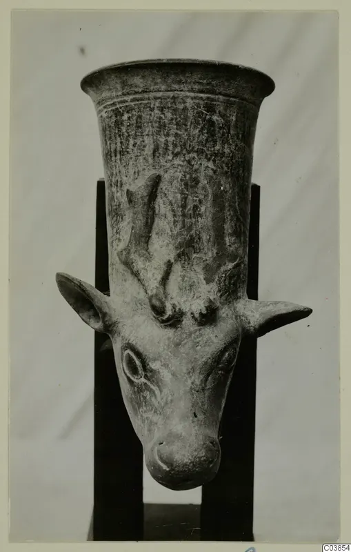 Pottery vessel with a flaring rim and a modelled animal head with ears and horns projecting from its body