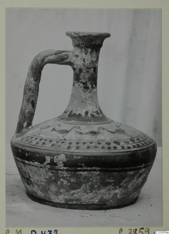 Jug with a single handle, flaring rim and painted bands of birds and dots on the shoulder