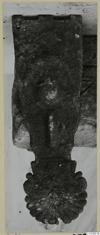 Bronze horse-trapping, a flat elongated plate with a lobed, scalloped lower end, corroded surface