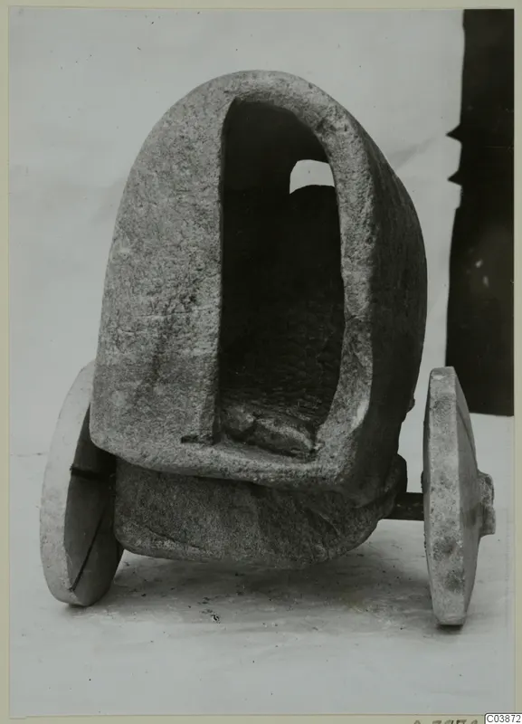 Stone model of a cart with an arched opening and two disc wheels, from Mersinaki