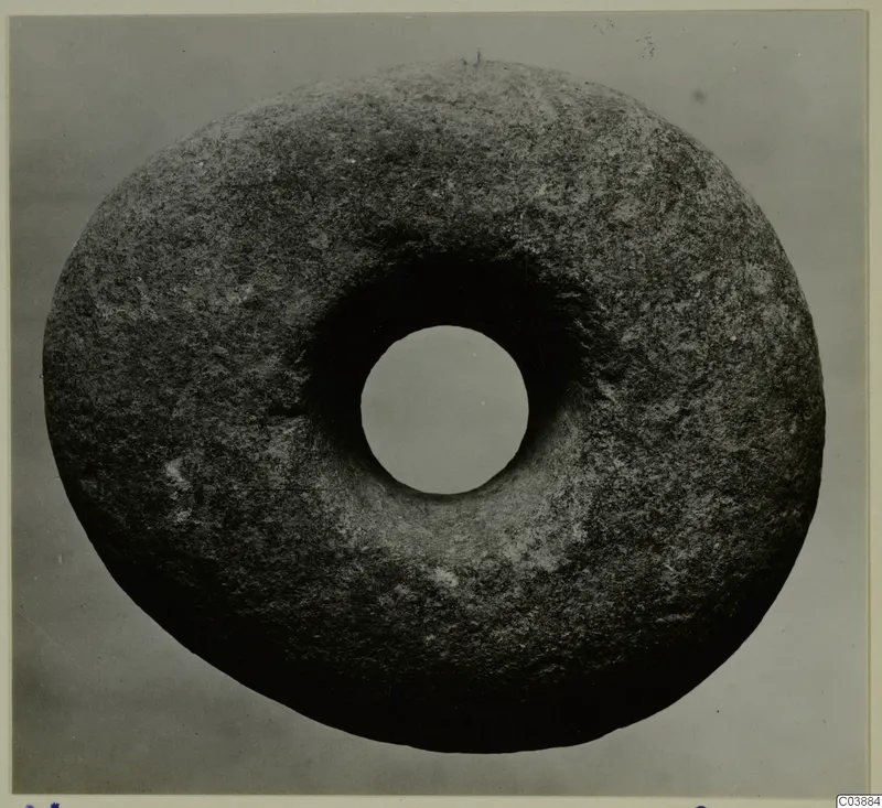 Ring-shaped stone object with a large central hole, photographed from above