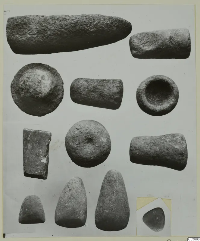 Stone objects from Kythrea: cylinders, bowl-like pieces and smooth rounded pieces on a card mount