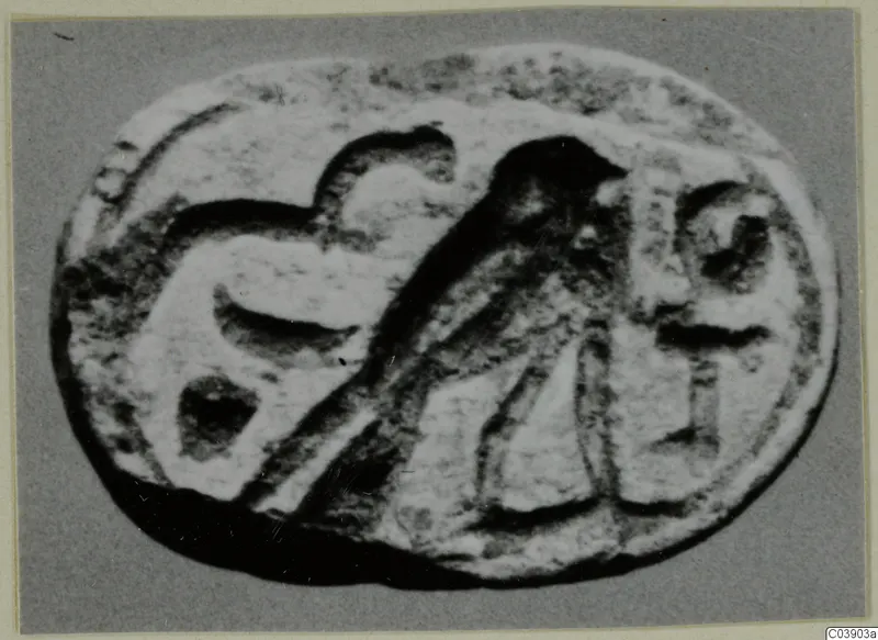 Oval engraved stone seal from Amathus, with a bird and other motifs carved on its face