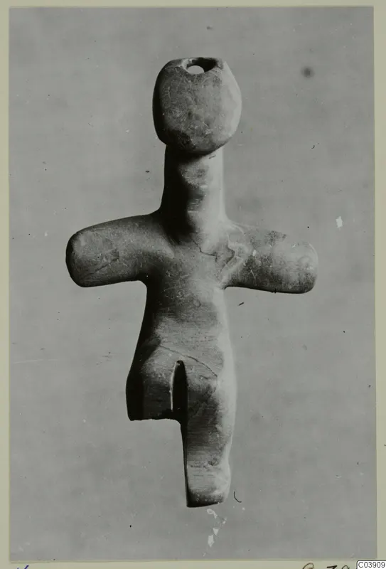 Steatite idol from Kythrea, a small standing figure with outstretched arms and a pierced head