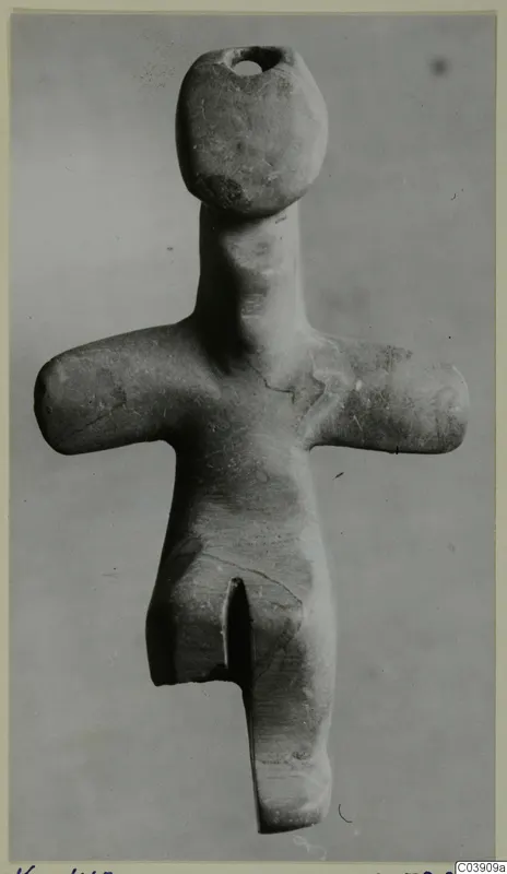 Stone figurine with outstretched arms and a perforated head, from Petra tou Limniti