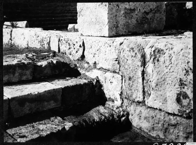 Stone steps and masonry blocks of the theatre at Soli during excavation