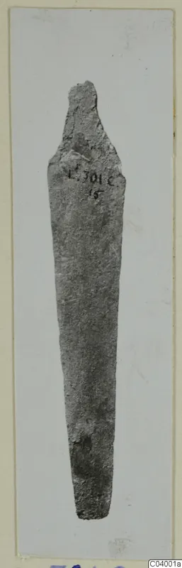 Corroded metal tool with a long tapering blade, from Lapithos.