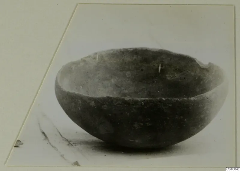 Red Polished III bowl from Lapithos, Vrysi tou Barba tombs, seen from the side on a pale surface