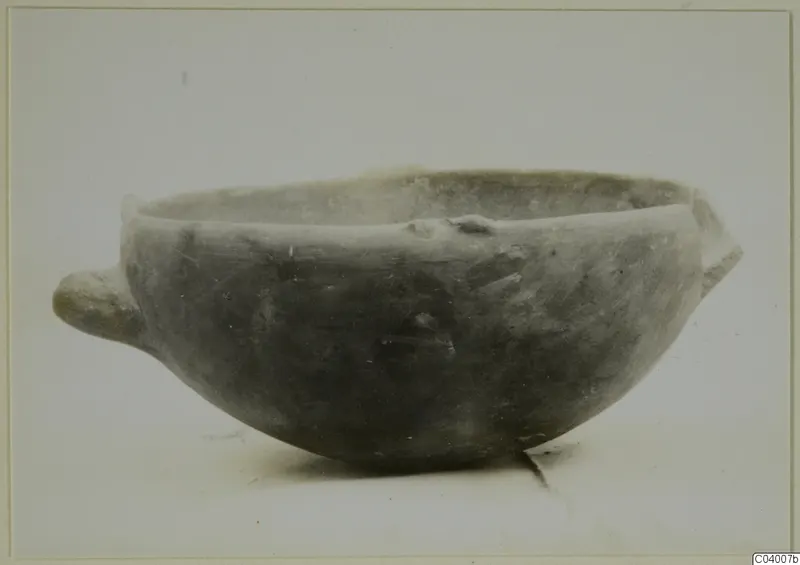 Pottery Red Polished III bowl with a small handle on each side, shown in side view