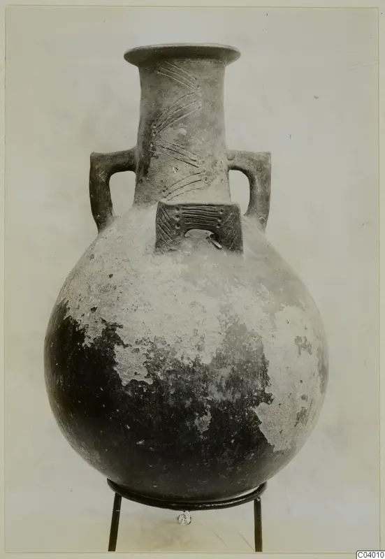 Pottery Red Polished III amphora with two handles and incised decoration on the neck and shoulder