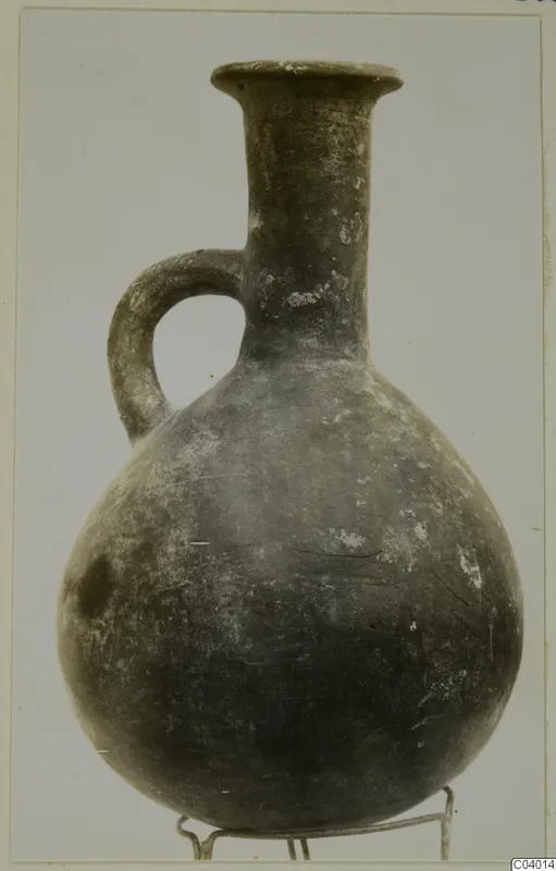 Pottery Red Polished III jug from Lapithos, with a single loop handle and a flared rim
