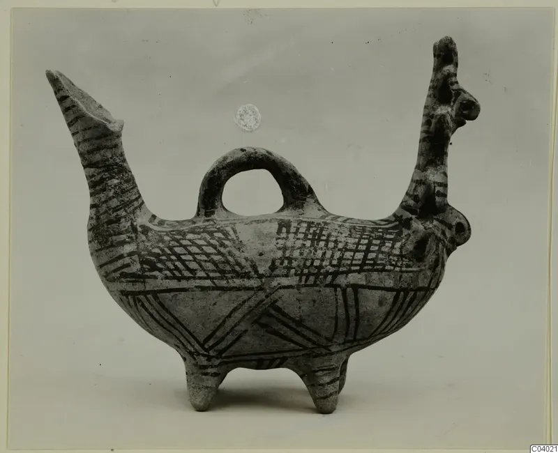 Pottery vessel with a long spout, a loop handle and dark painted bands and cross-hatching, White Painted II